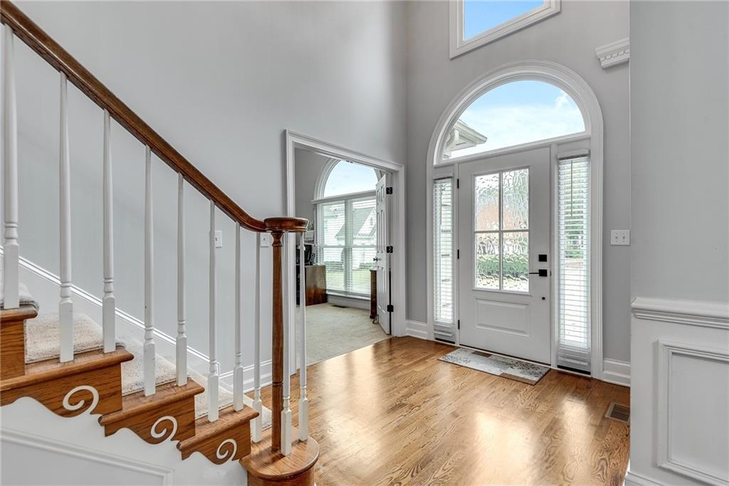 3969 Walkers Ridge Court Dacula, GA 30019 - Photo 6 of 60 a view of a livingroom with wooden floor