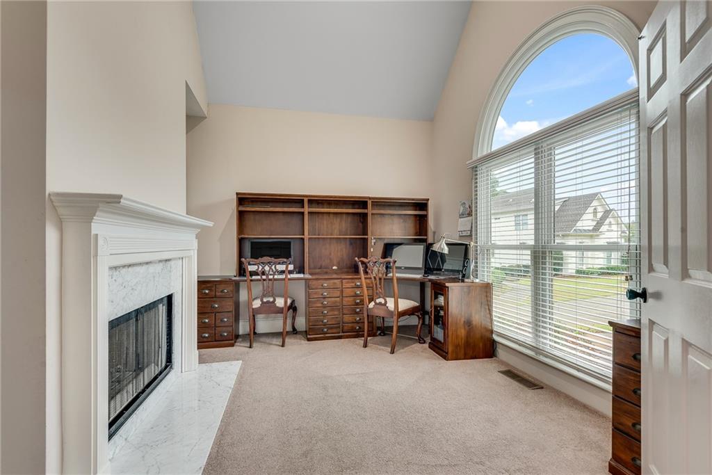 3969 Walkers Ridge Court Dacula, GA 30019 - Photo 7 of 60 a living room with furniture a fireplace and flat screen tv