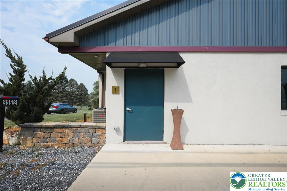 335 Walnut Drive, Unit 1 Northampton, PA 18067 - Photo 1 of 29 a view of entryway with garden