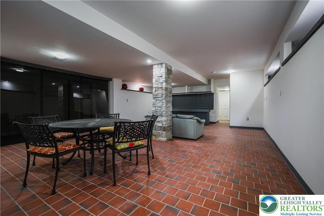 335 Walnut Drive, Unit 1 Northampton, PA 18067 - Photo 19 of 29 a open kitchen with a table and chairs