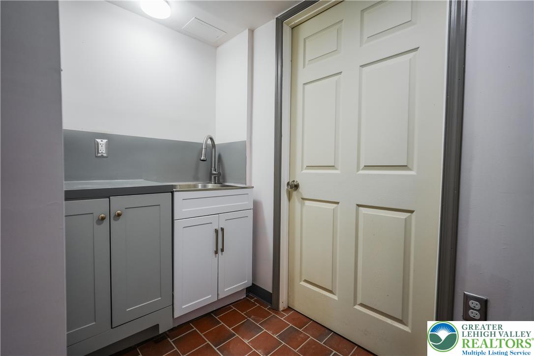 335 Walnut Drive, Unit 1 Northampton, PA 18067 - Photo 22 of 29 a bathroom with a sink a toilet and a mirror