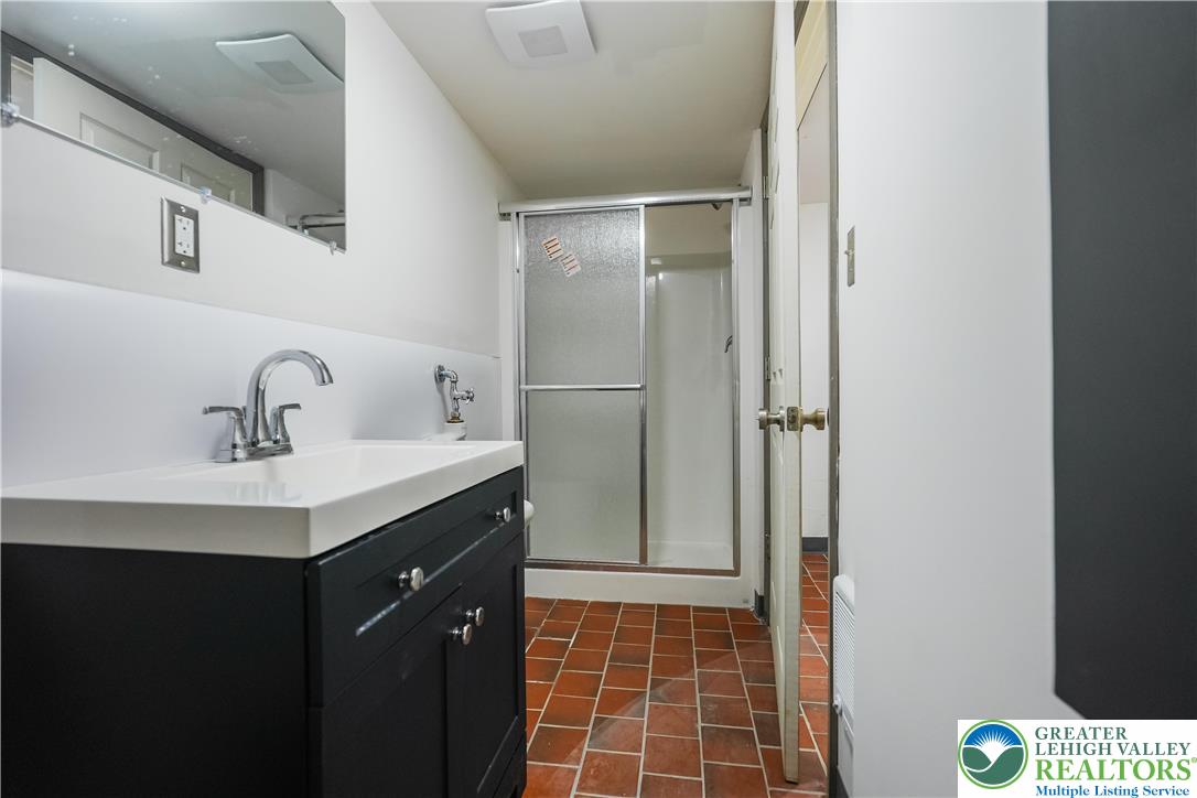 335 Walnut Drive, Unit 1 Northampton, PA 18067 - Photo 24 of 29 a bathroom with a sink toilet and shower