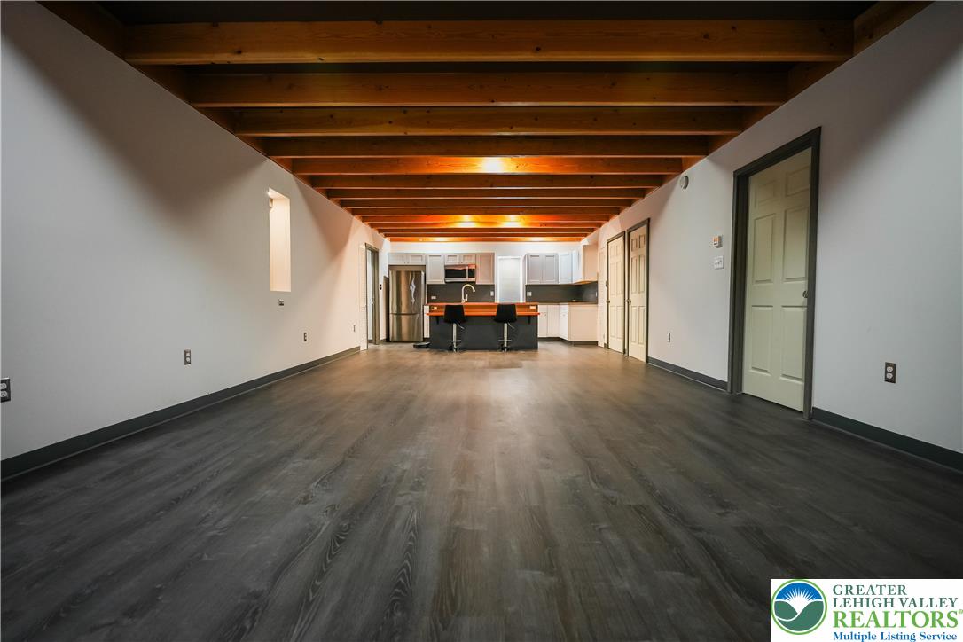 335 Walnut Drive, Unit 1 Northampton, PA 18067 - Photo 4 of 29 a view of empty room with wooden floor