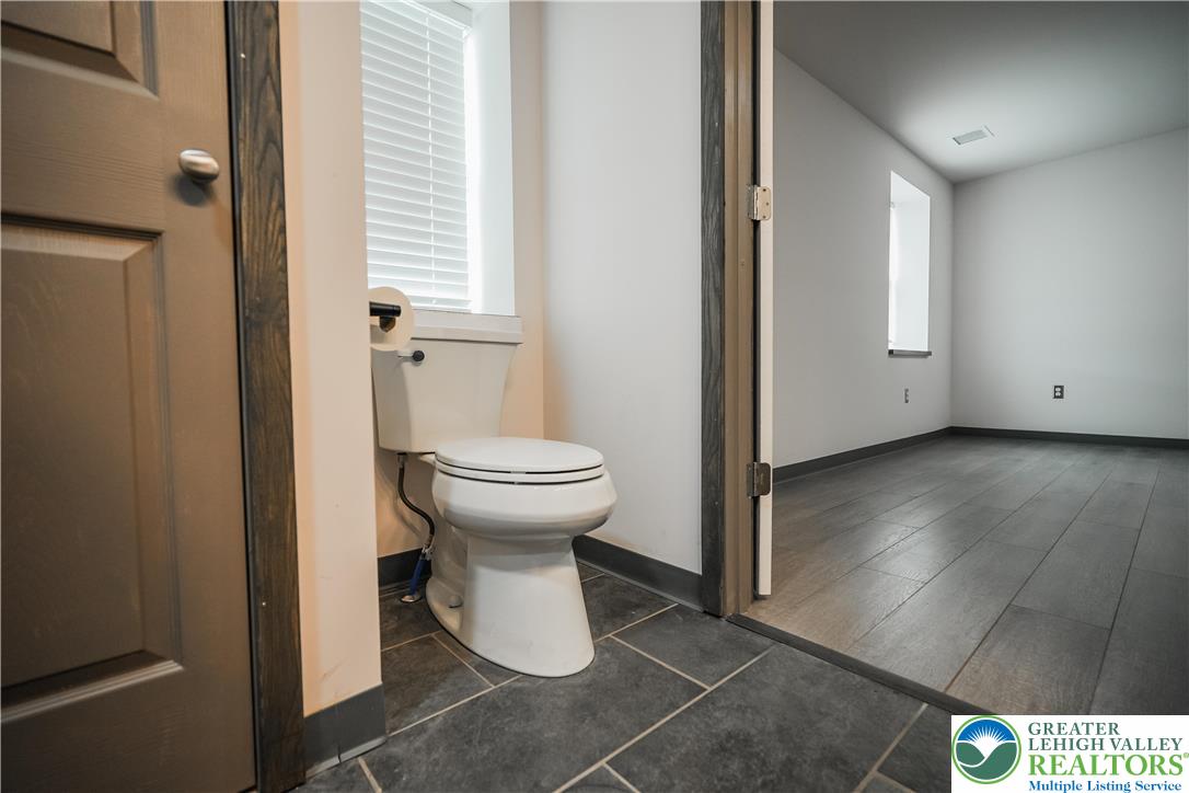 335 Walnut Drive, Unit 1 Northampton, PA 18067 - Photo 10 of 29 a view of a bathroom with a sink and toilet