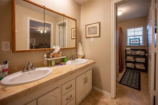a bathroom with a sink double vanity and a mirror