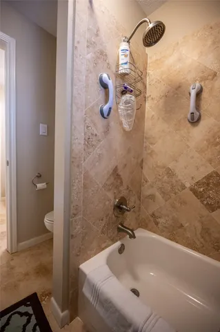 a bathroom with a tub and a shower