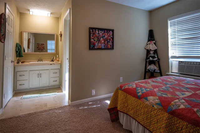 a bedroom with a bed and a cabinets