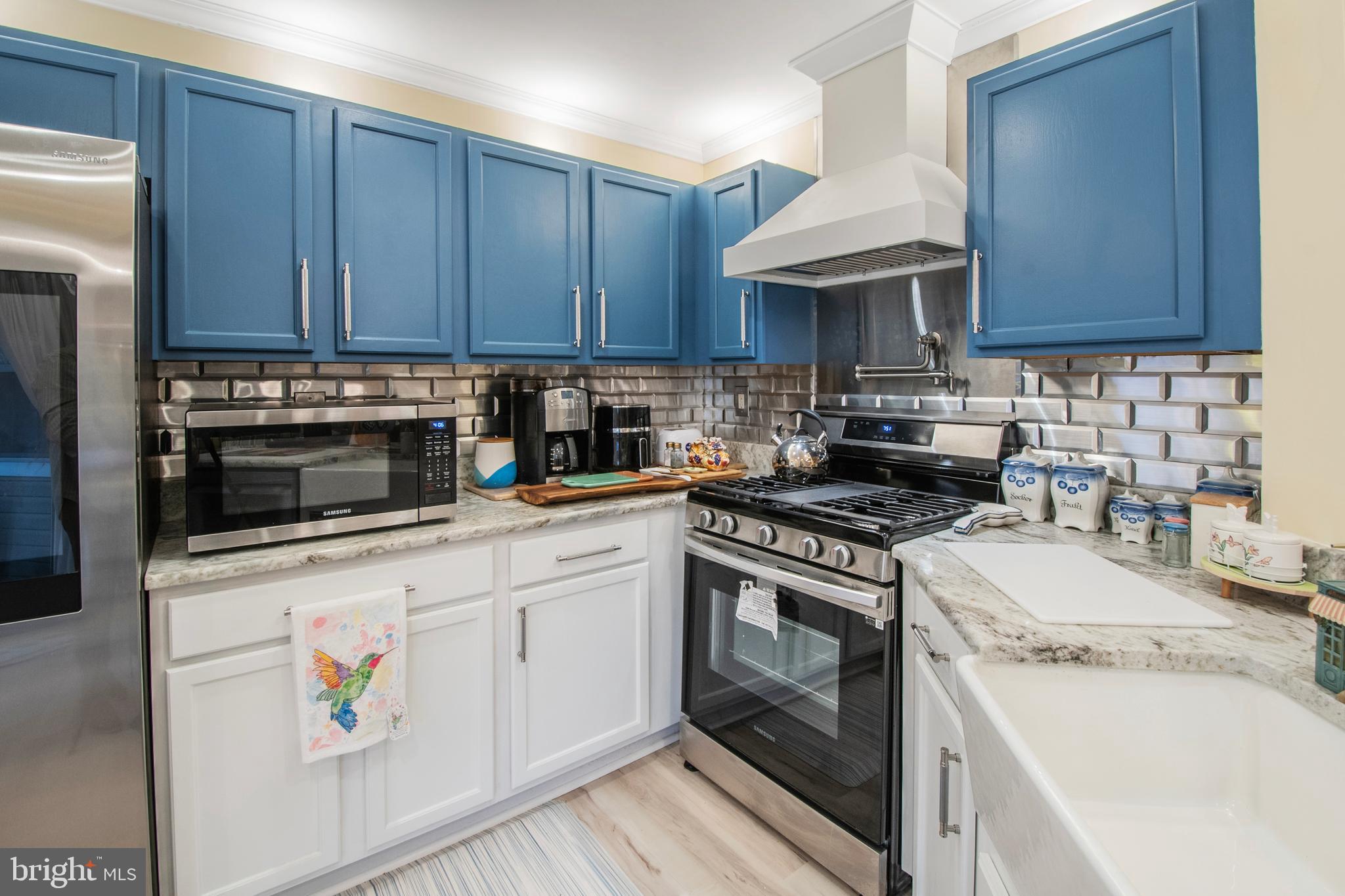 511 Mowat Circle Hamilton, NJ 08690 - Photo 13 of 46 a kitchen with stainless steel appliances granite countertop a stove and a sink