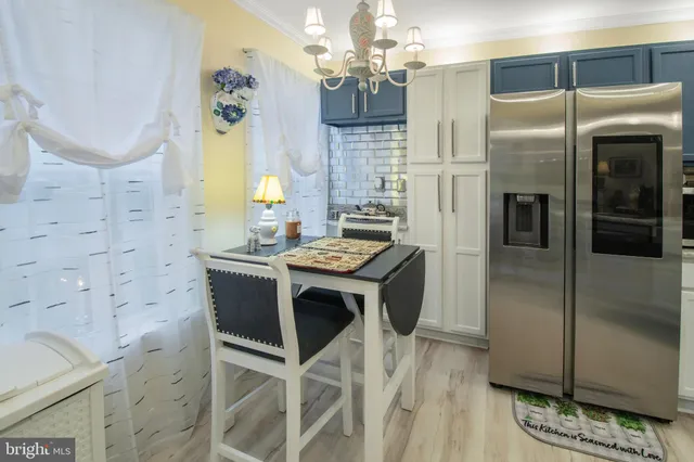 a kitchen with cabinets and stainless steel appliances