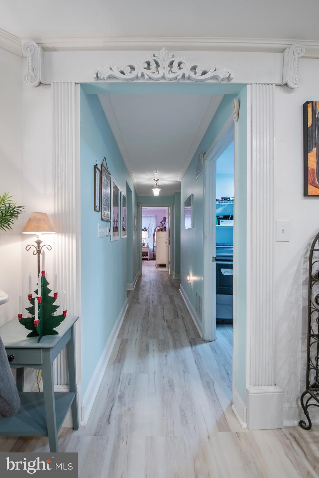 511 Mowat Circle Hamilton, NJ 08690 - Photo 20 of 46 a view of a hallway to a livingroom with wooden floor and furniture