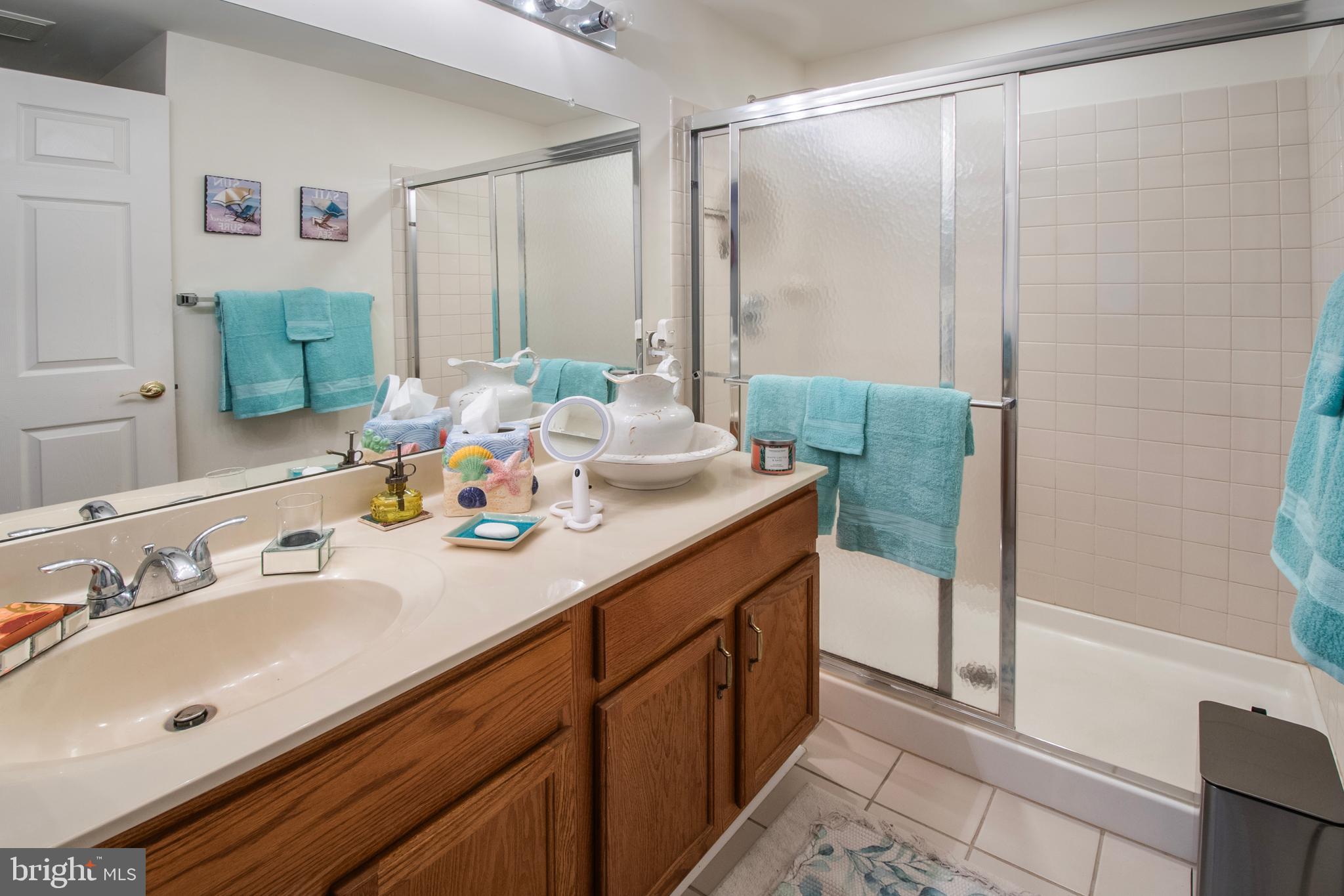 511 Mowat Circle Hamilton, NJ 08690 - Photo 22 of 46 a bathroom with a double vanity sink mirror and shower
