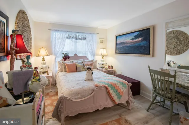 a bed room with a bed and a chair