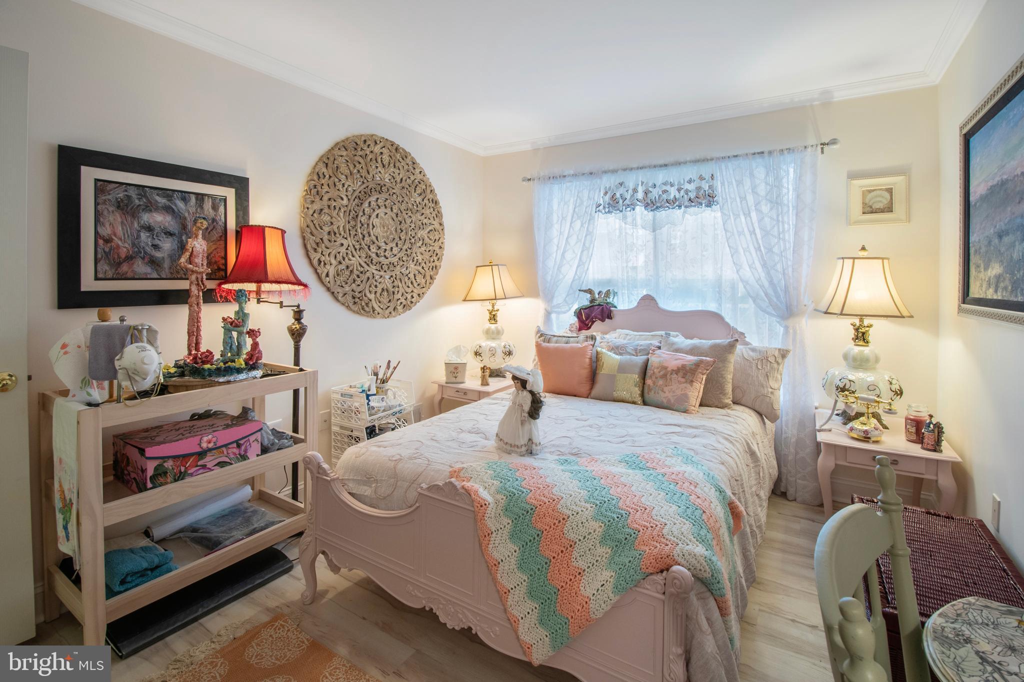 511 Mowat Circle Hamilton, NJ 08690 - Photo 25 of 46 a bedroom with a bed a painting on the wall and a window