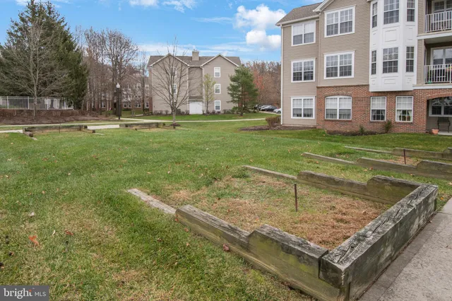 a view of a house with a yard porch and sitting area