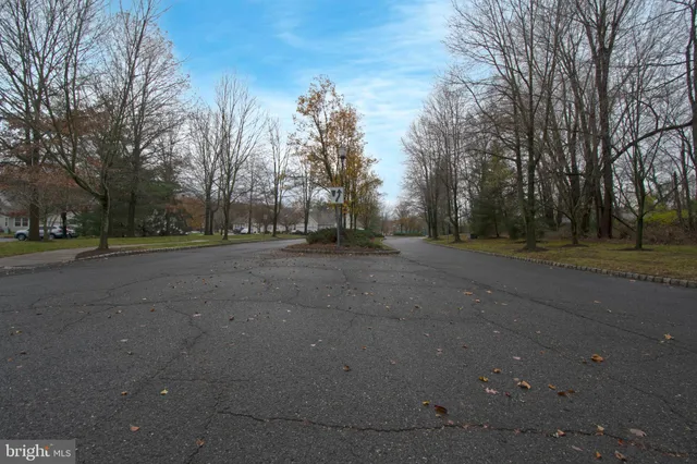 front view of a brick house with a yard