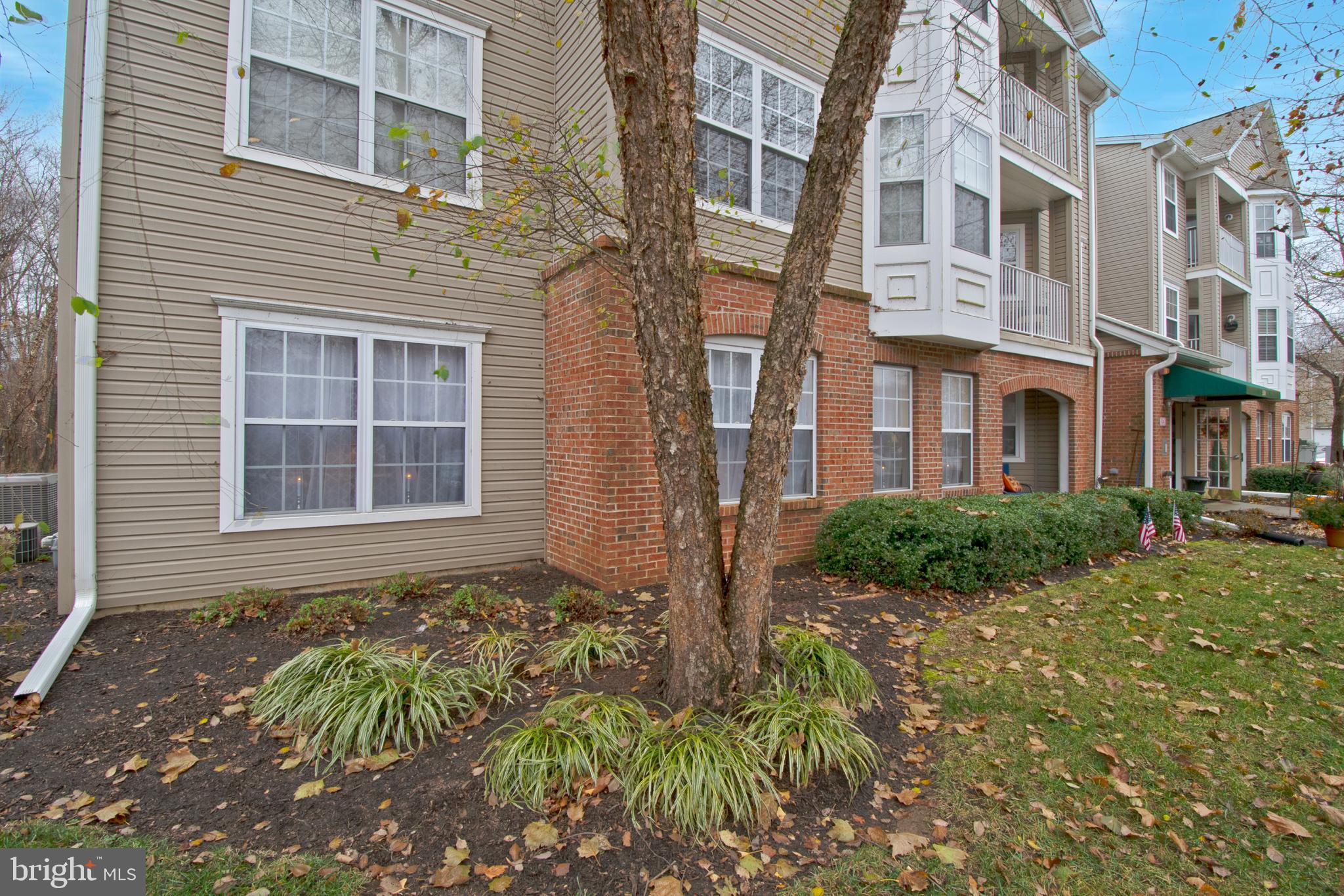 511 Mowat Circle Hamilton, NJ 08690 - Photo 46 of 46 a view of a brick building next to a yard