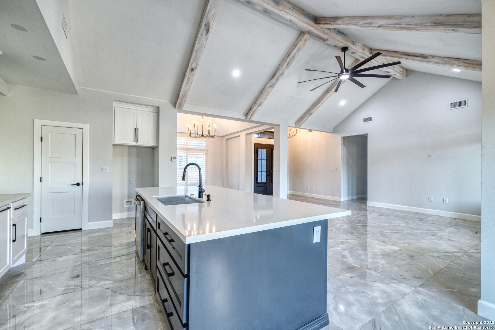 14 Hope Place Uvalde, TX 78801 - Photo 16 of 38 a kitchen with stainless steel appliances granite countertop a sink and a refrigerator