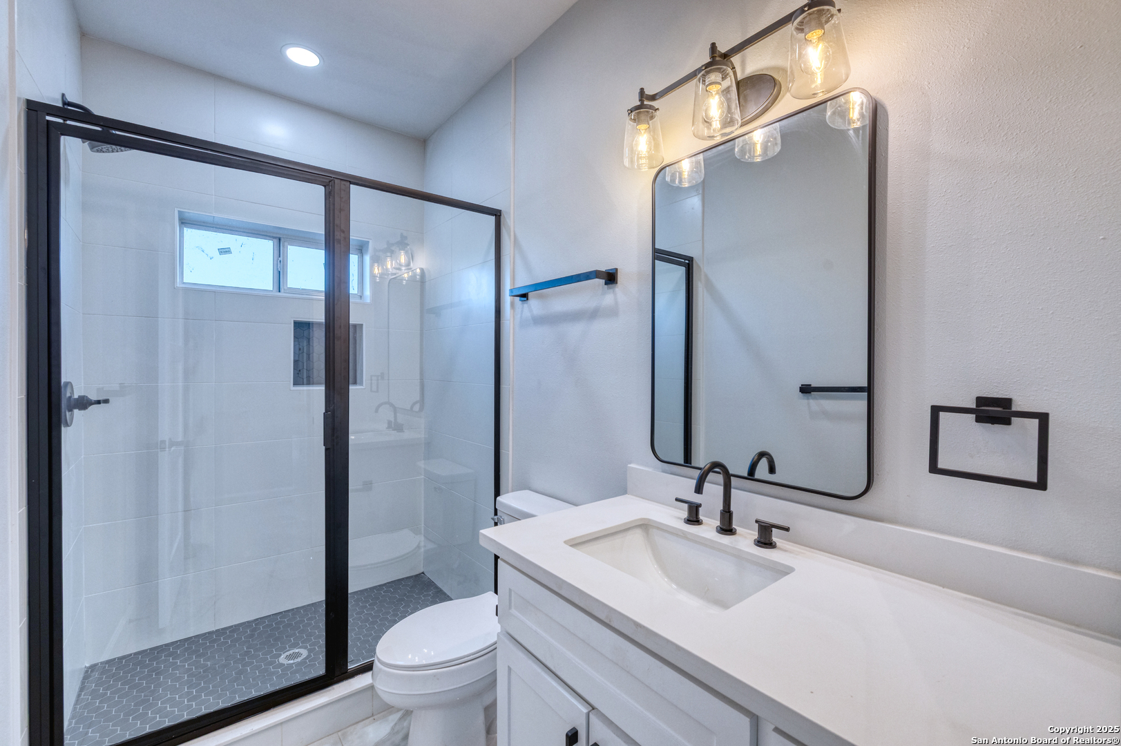 14 Hope Place Uvalde, TX 78801 - Photo 22 of 38 a bathroom with a sink a toilet and shower