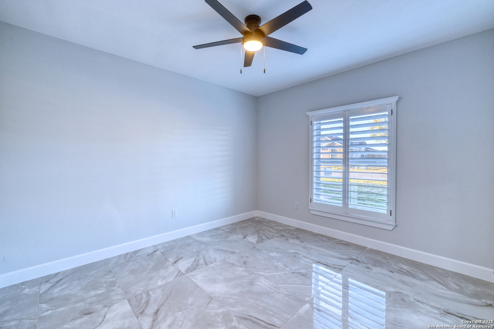 14 Hope Place Uvalde, TX 78801 - Photo 23 of 38 wooden floor in an empty room with a window