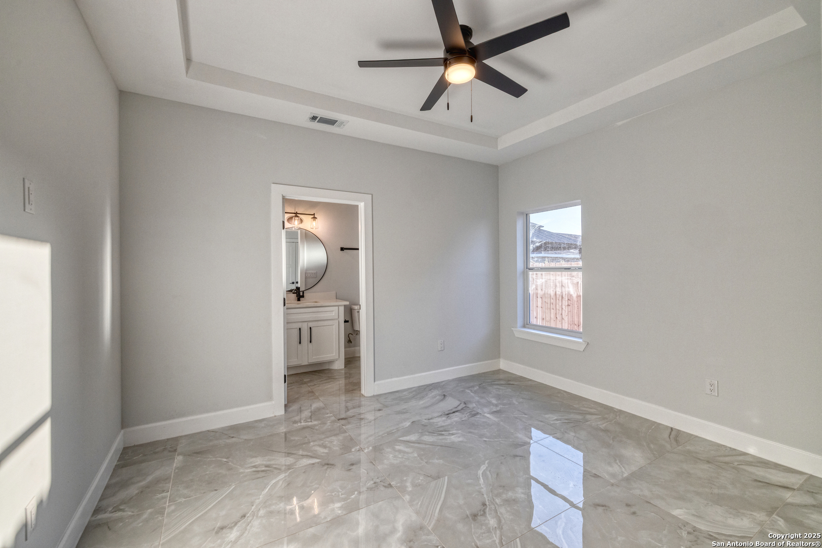 14 Hope Place Uvalde, TX 78801 - Photo 25 of 38 a view of empty room with window and ceiling fan