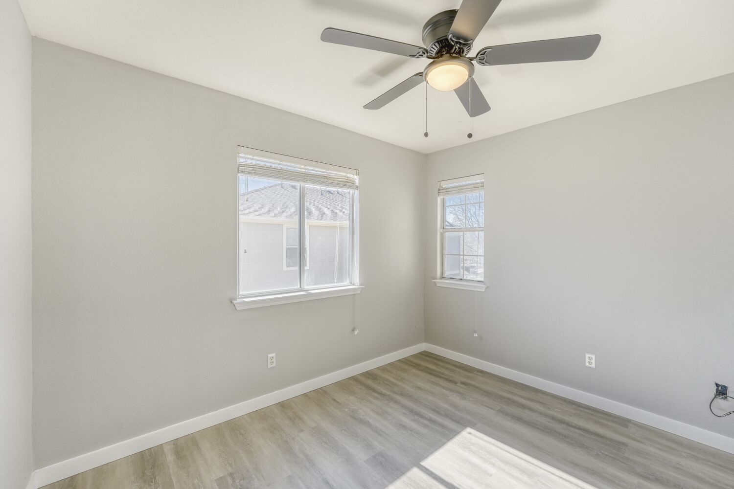 904 Sebastian Bend, Unit B Pflugerville, TX 78660 - Photo 12 of 30 an empty room with a window and a fan