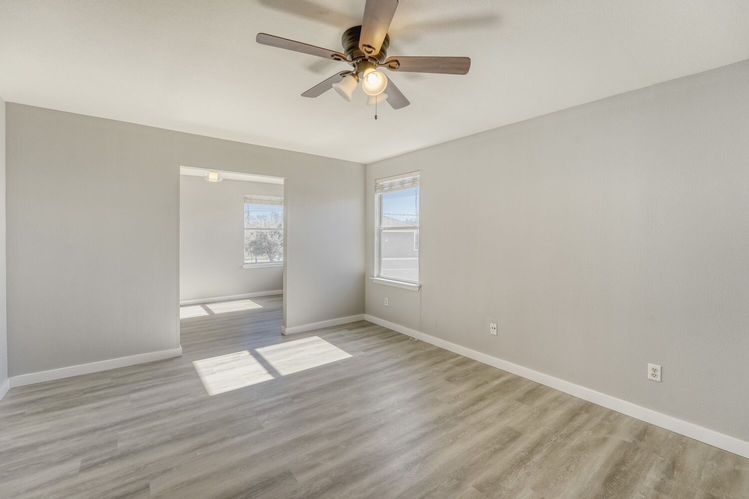 904 Sebastian Bend, Unit B Pflugerville, TX 78660 - Photo 17 of 30 wooden floor in an empty room with a window