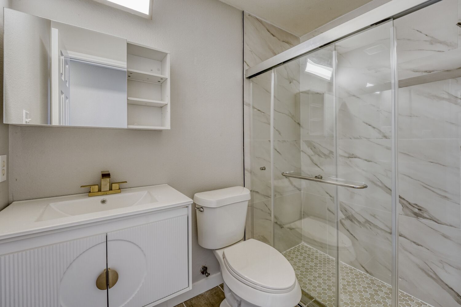 904 Sebastian Bend, Unit B Pflugerville, TX 78660 - Photo 21 of 30 a bathroom with a sink a toilet and shower