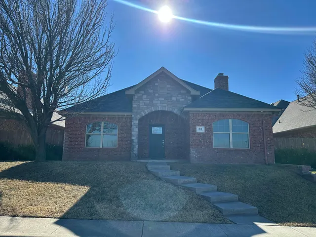 a view of a brick house with a door