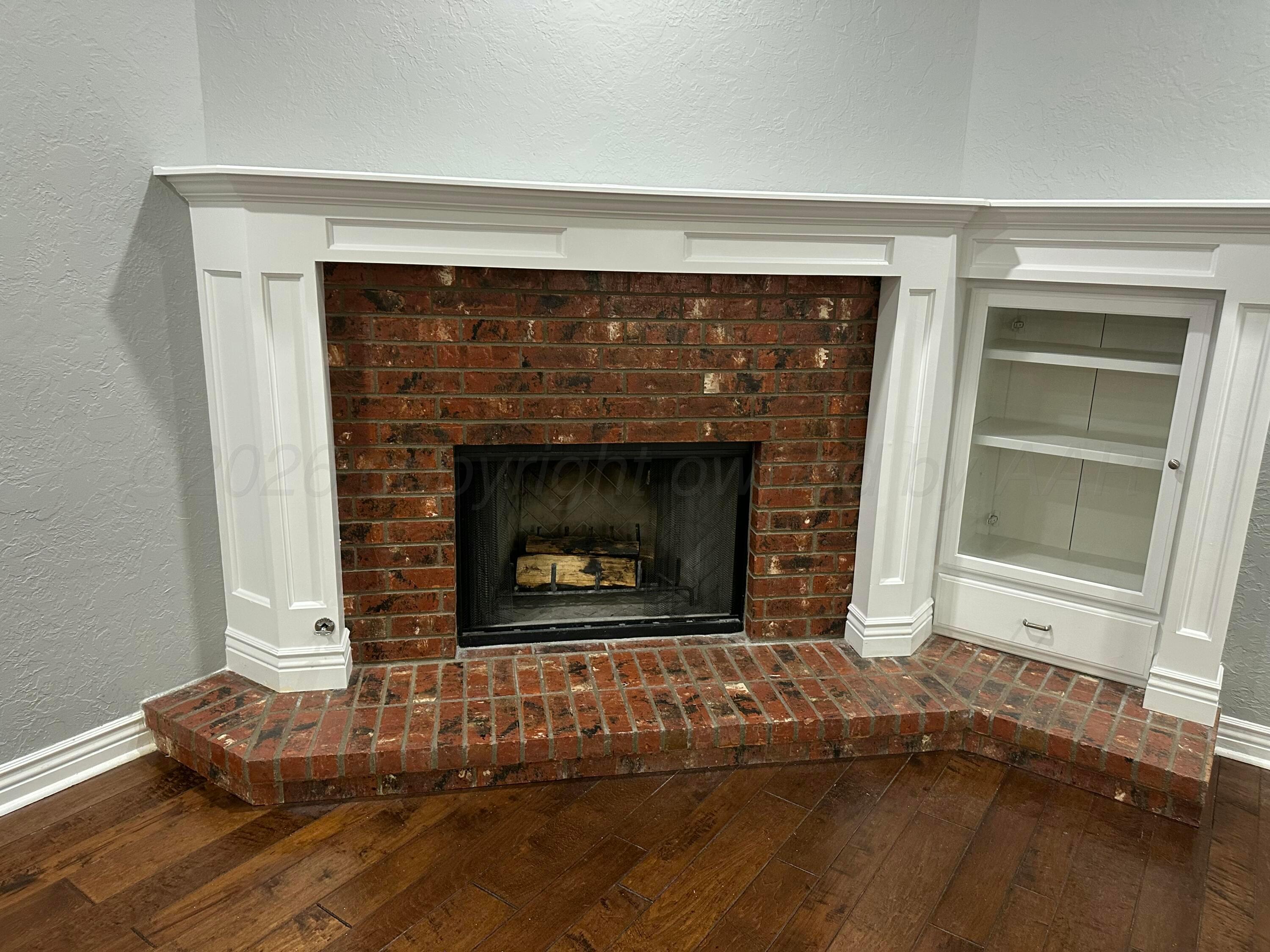 2 Cambridge Place Borger, TX 79007 - Photo 8 of 22 a living room with a fireplace