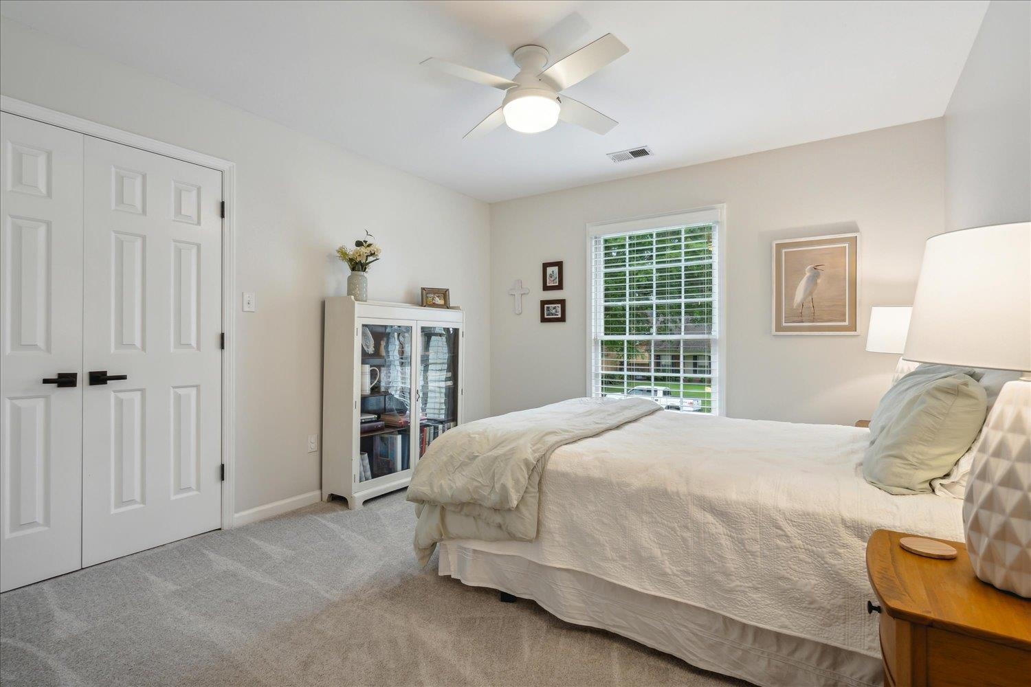 1001 Yorktown Road Collierville, TN 38017 - Photo 24 of 40 Bedroom with light carpet, a closet, and ceiling fan