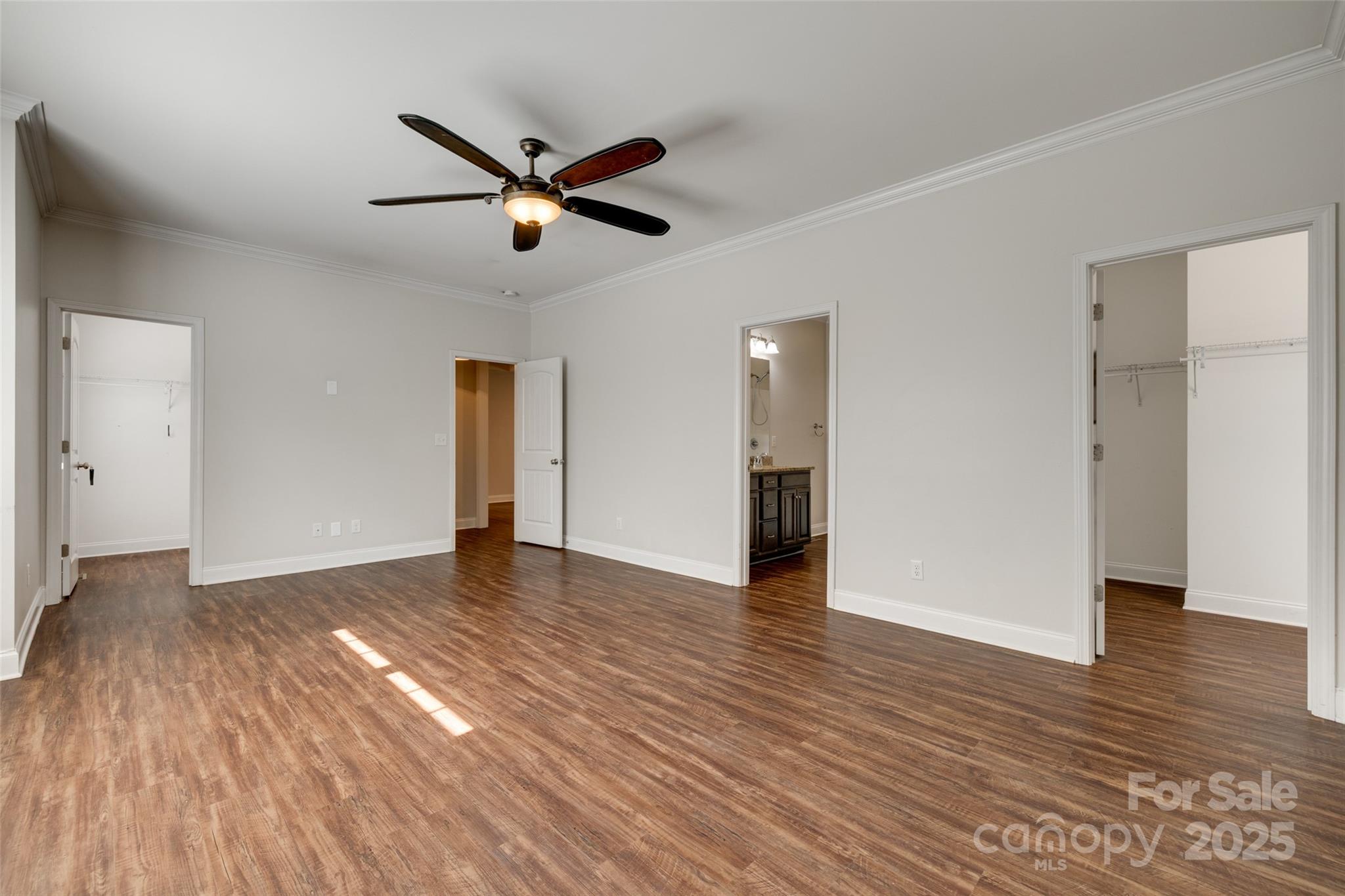 3243 Farmcrest Court Fort Mill, SC 29708 - Photo 12 of 45 a view of empty room with wooden floor and ceiling fan