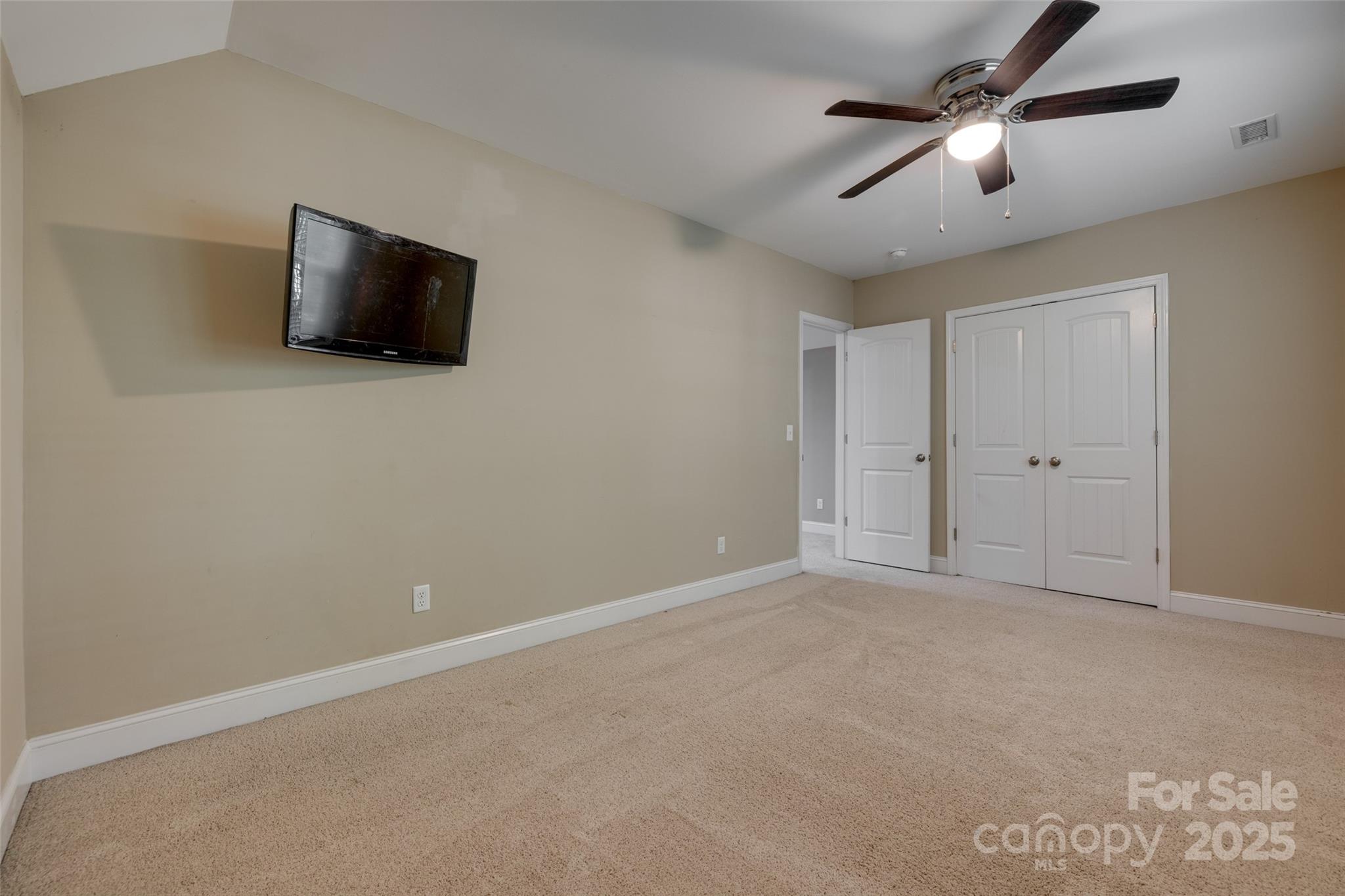3243 Farmcrest Court Fort Mill, SC 29708 - Photo 26 of 45 a view of an empty room with a ceiling fan