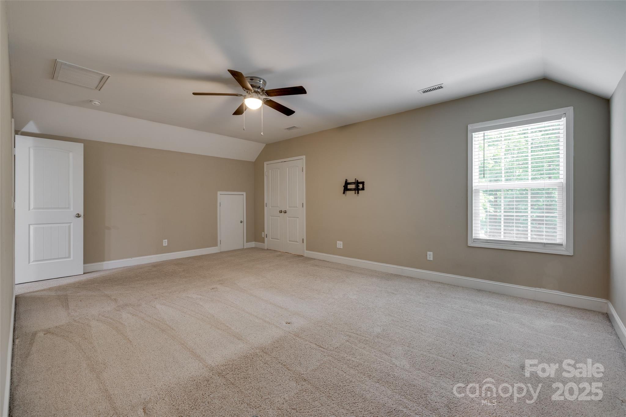 3243 Farmcrest Court Fort Mill, SC 29708 - Photo 28 of 45 an empty room with windows and fan