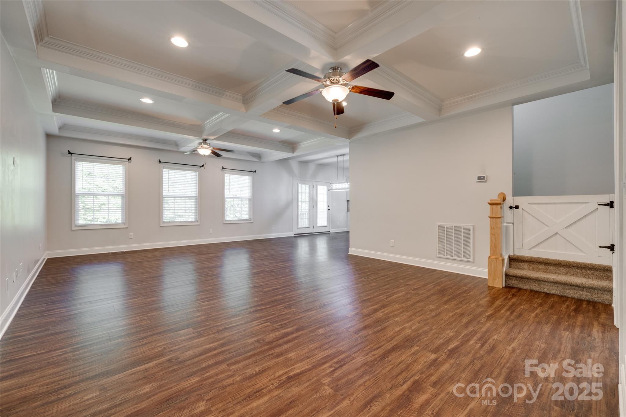 3243 Farmcrest Court Fort Mill, SC 29708 - Photo 3 of 45 an empty room with wooden floor and windows