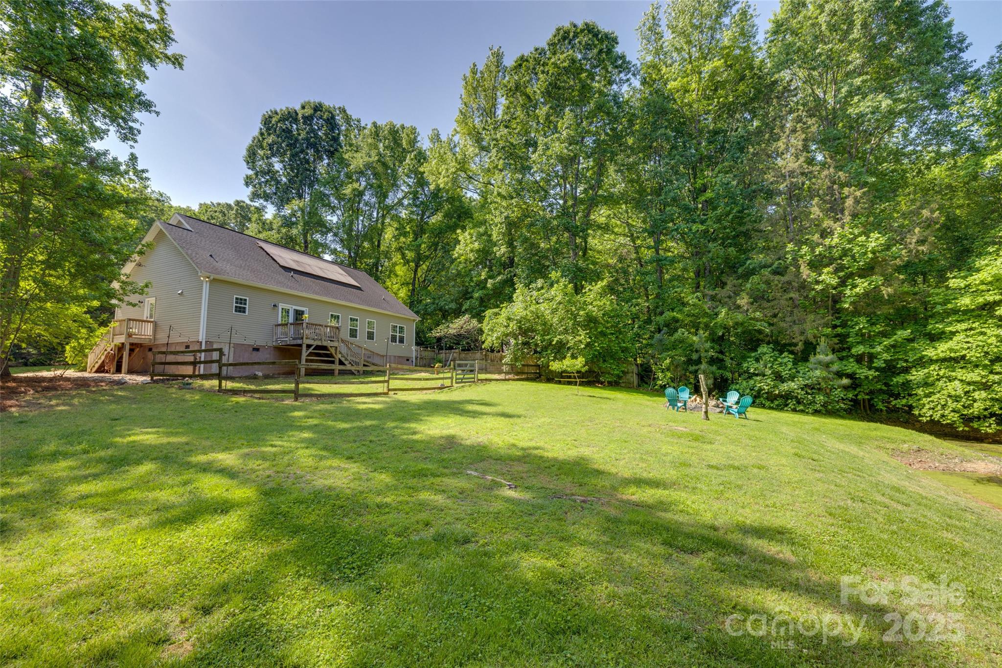 3243 Farmcrest Court Fort Mill, SC 29708 - Photo 35 of 45 a swimming pool is sitting in the grass with large trees