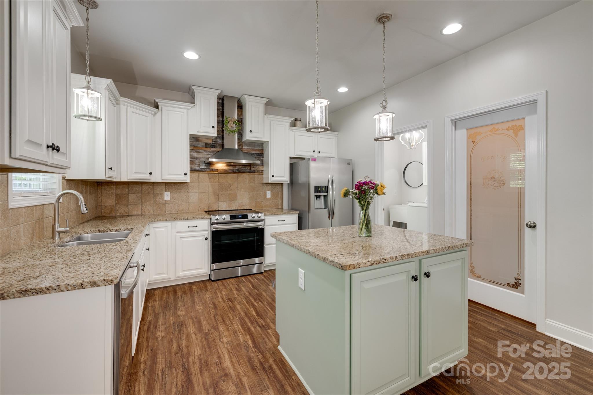 3243 Farmcrest Court Fort Mill, SC 29708 - Photo 7 of 45 a kitchen with stainless steel appliances granite countertop a sink stove and refrigerator