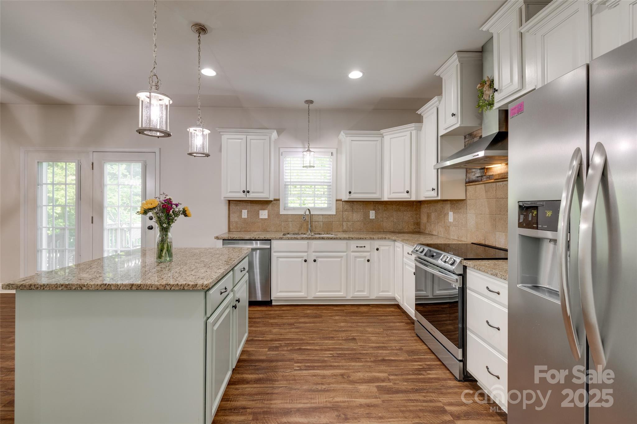 3243 Farmcrest Court Fort Mill, SC 29708 - Photo 9 of 45 a kitchen with granite countertop a refrigerator stove top oven and sink