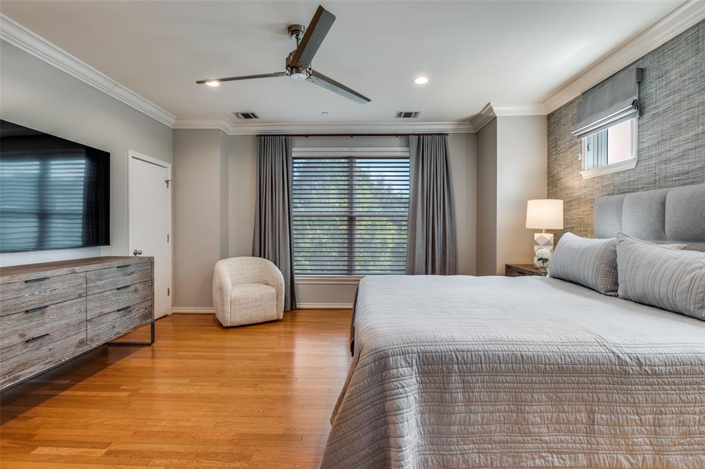 4223 Buena Vista Street, Unit 1 Dallas, TX 75205 - Photo 12 of 22 a bedroom with a large bed and a large window