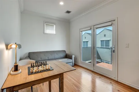a bedroom with furniture and window