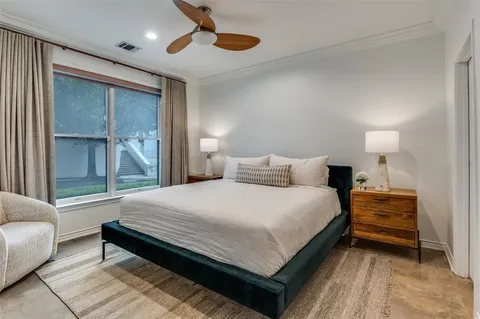 a bedroom with a bed and a couch