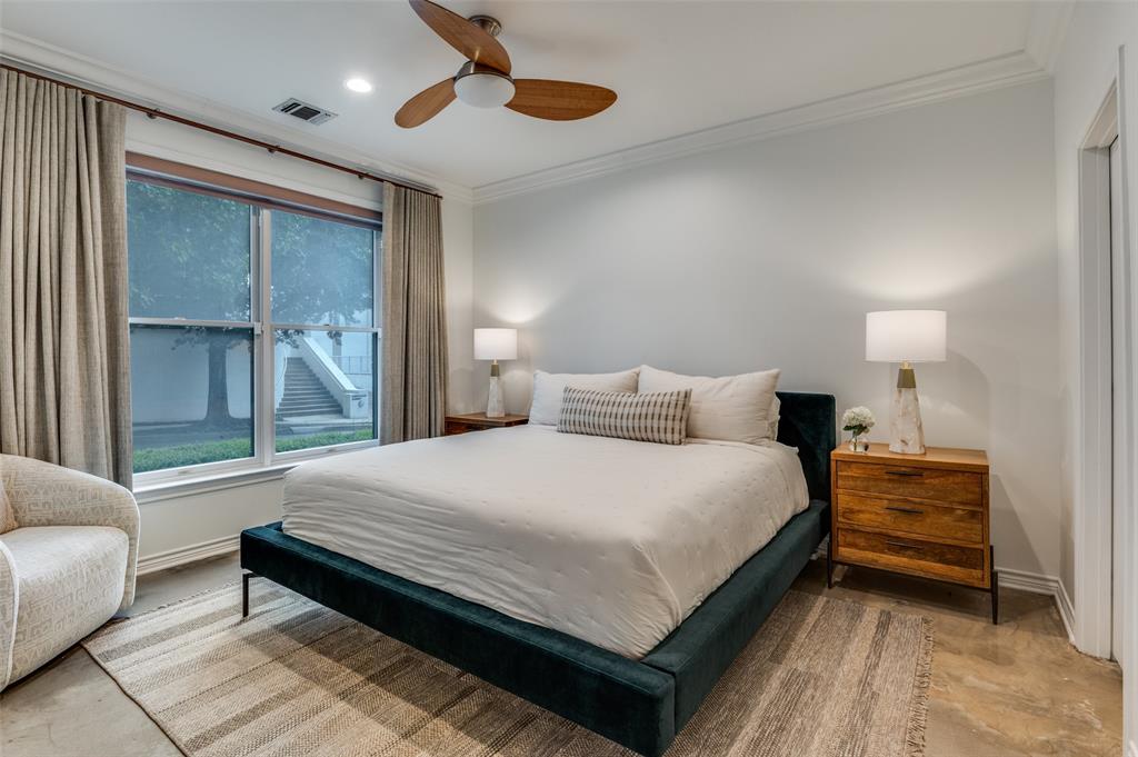 4223 Buena Vista Street, Unit 1 Dallas, TX 75205 - Photo 18 of 22 a bedroom with a bed and a couch