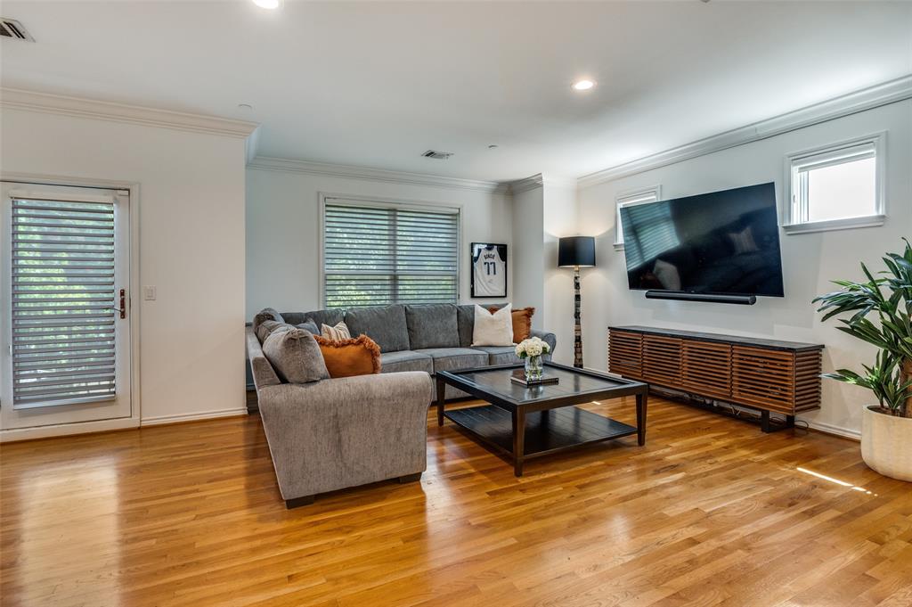 4223 Buena Vista Street, Unit 1 Dallas, TX 75205 - Photo 6 of 22 a living room with furniture and a flat screen tv