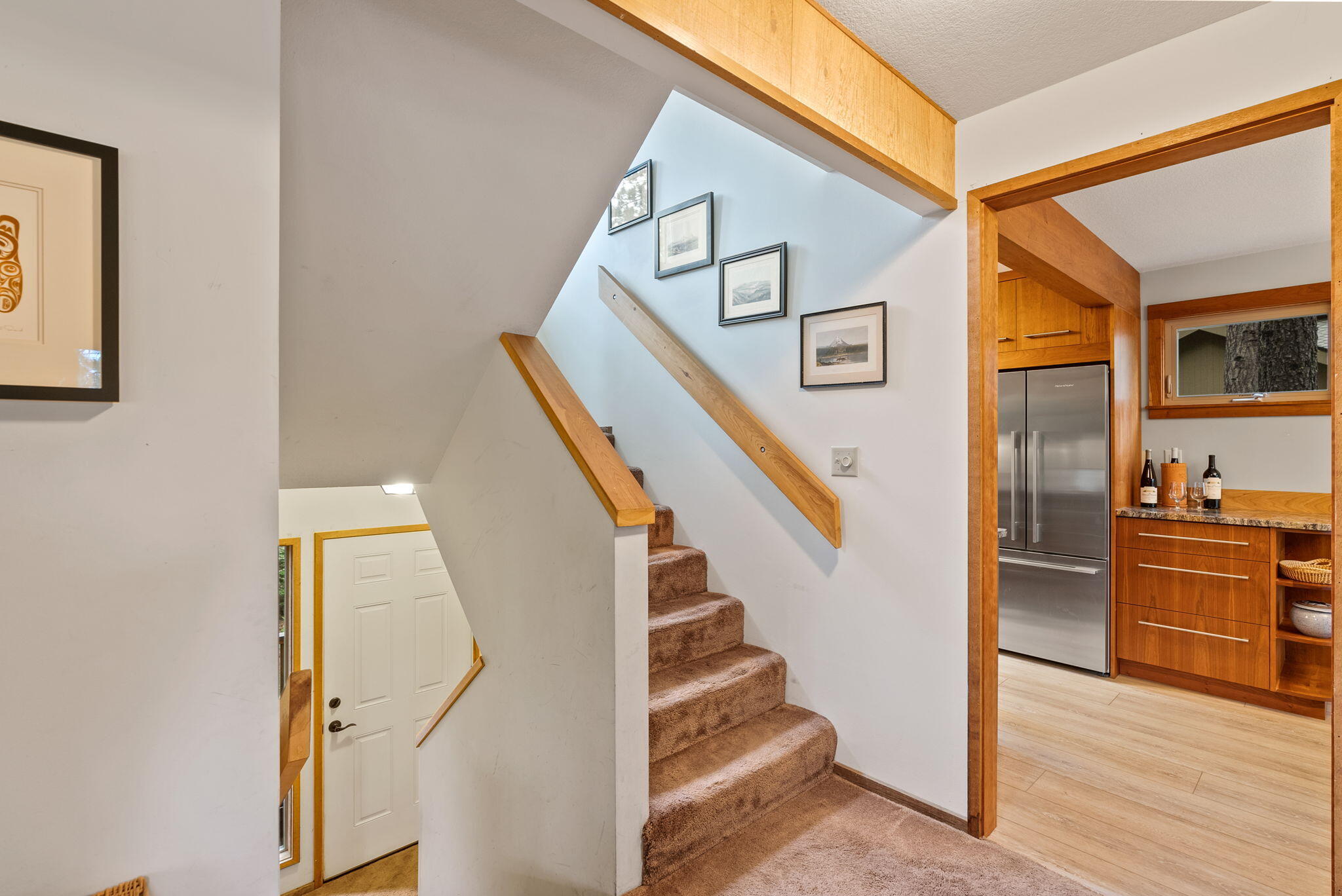 13251 Snowbrush, Unit GH 266 Black Butte Ranch, OR 97759 - Photo 11 of 37 a view of a hallway with wooden floor and staircase
