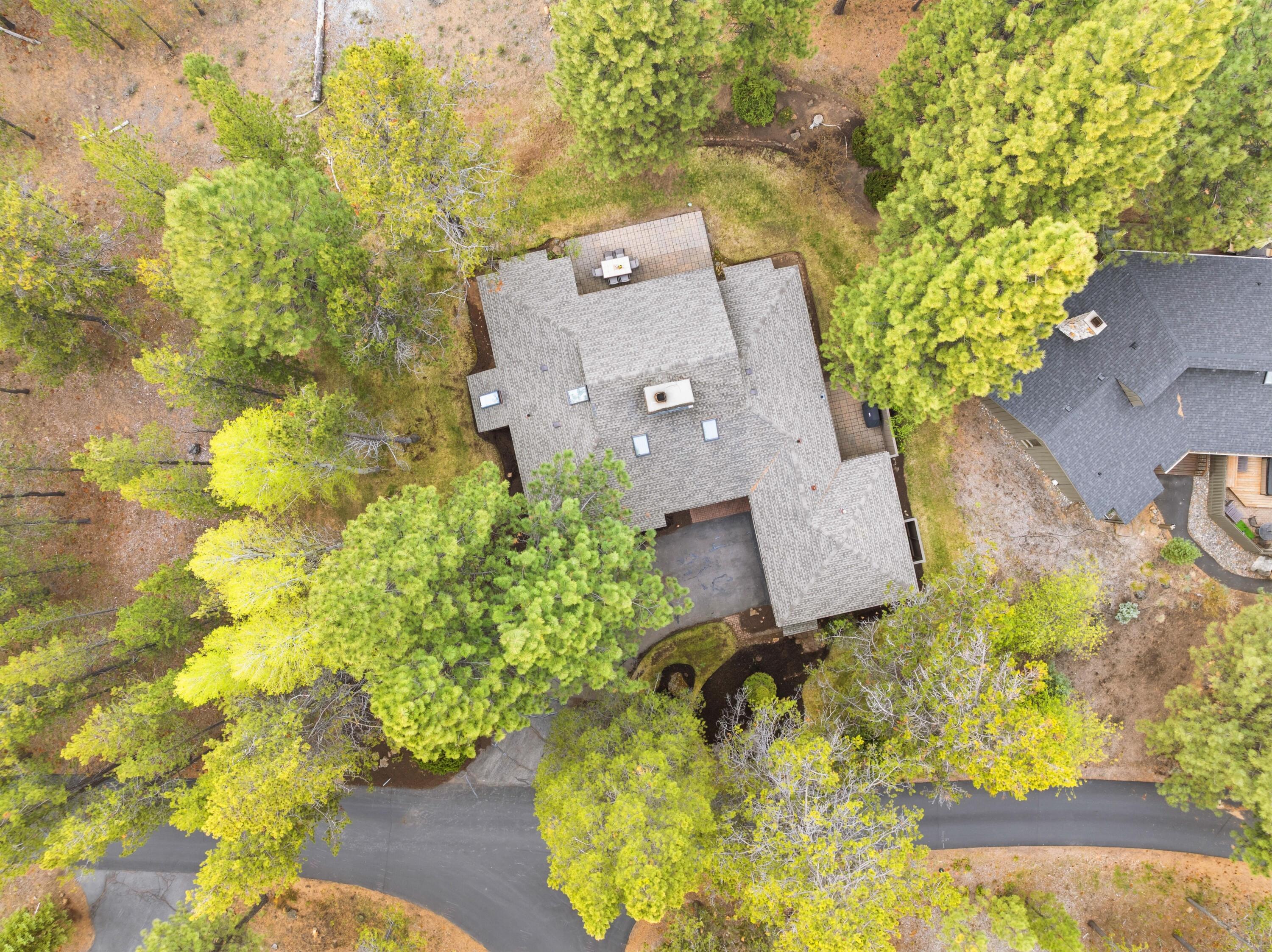 17866 Grouse Lane, Unit 3 Sunriver, OR 97707 - Photo 58 of 61 view of a house with a yard and a garden