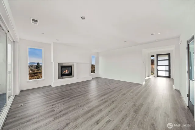 wooden floor in an empty room with window