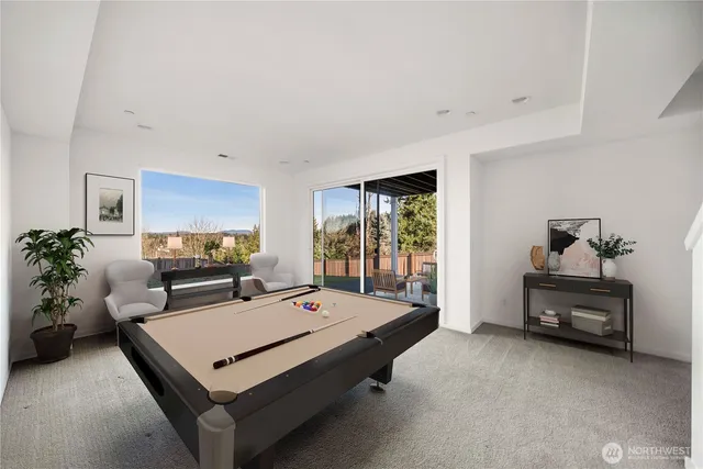 a living room with furniture a rug and a chandelier
