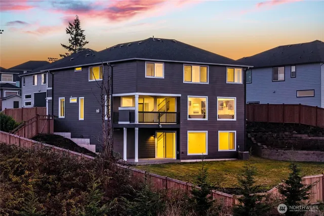a front view of a residential apartment building with a yard