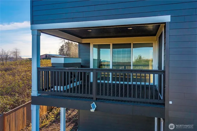 a view of a porch with a floor to ceiling window