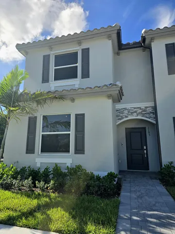 a front view of a house with yard