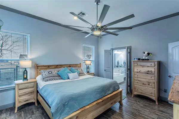 a bedroom with a bed and a table